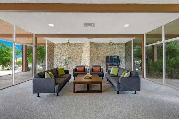a living room with furniture and a large window