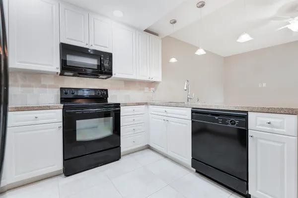 a kitchen with a stove and a microwave