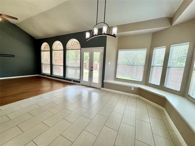 a view of an empty room with windows