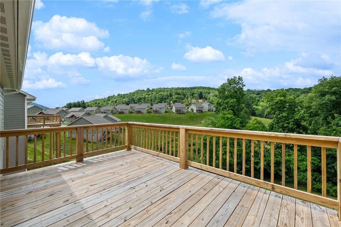 245 Ava Way, Unit 108 Boone, NC 28607 - Photo 6 of 31 a view of balcony with wooden floor and city view