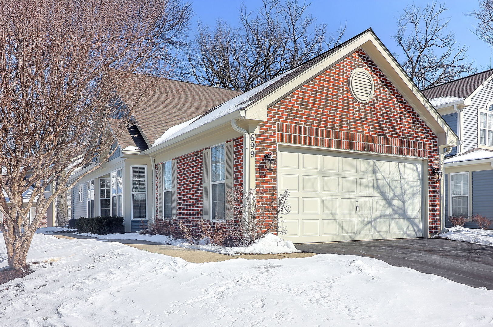 699 Bent Ridge Lane Elgin, IL 60120 - Photo 17 of 18 a front view of a house with a yard and garage
