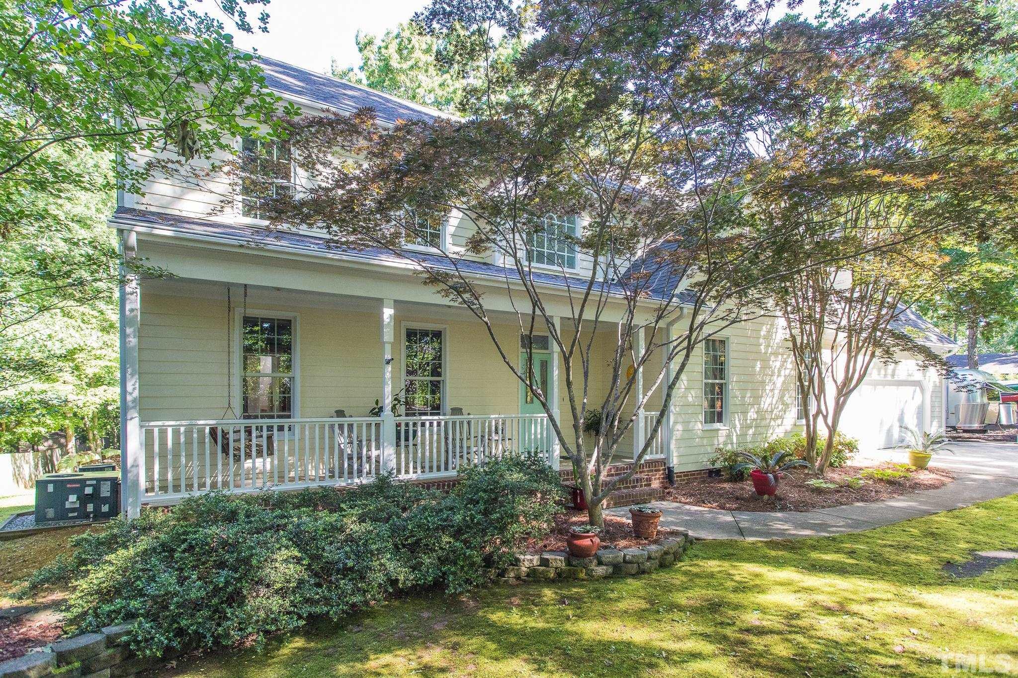 10300 Baileywick Road Raleigh, NC 27613 - Photo 1 of 26 a view of a house with a small yard and large tree