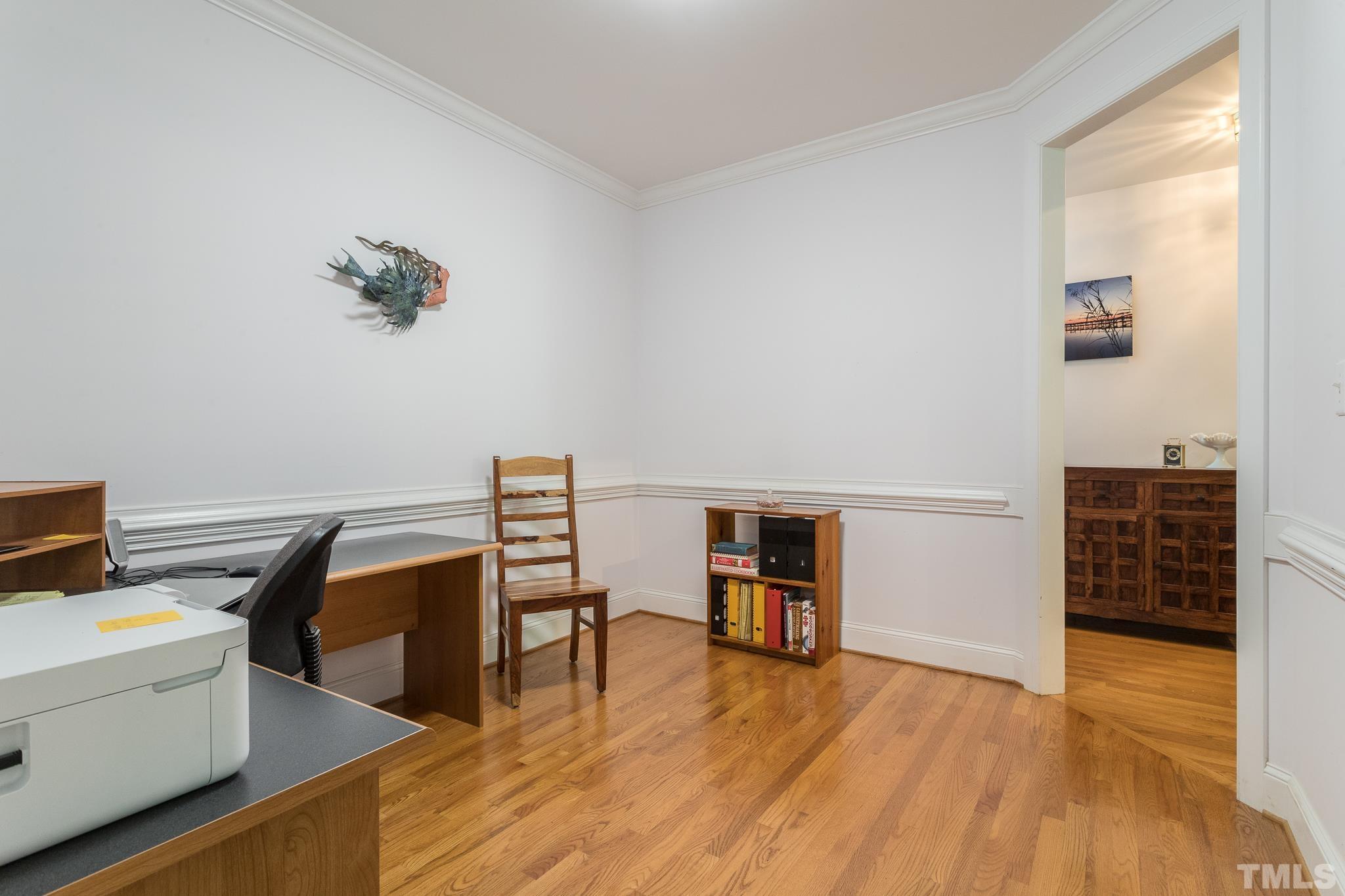 10300 Baileywick Road Raleigh, NC 27613 - Photo 12 of 26 a view of a workspace with furniture and wooden floor