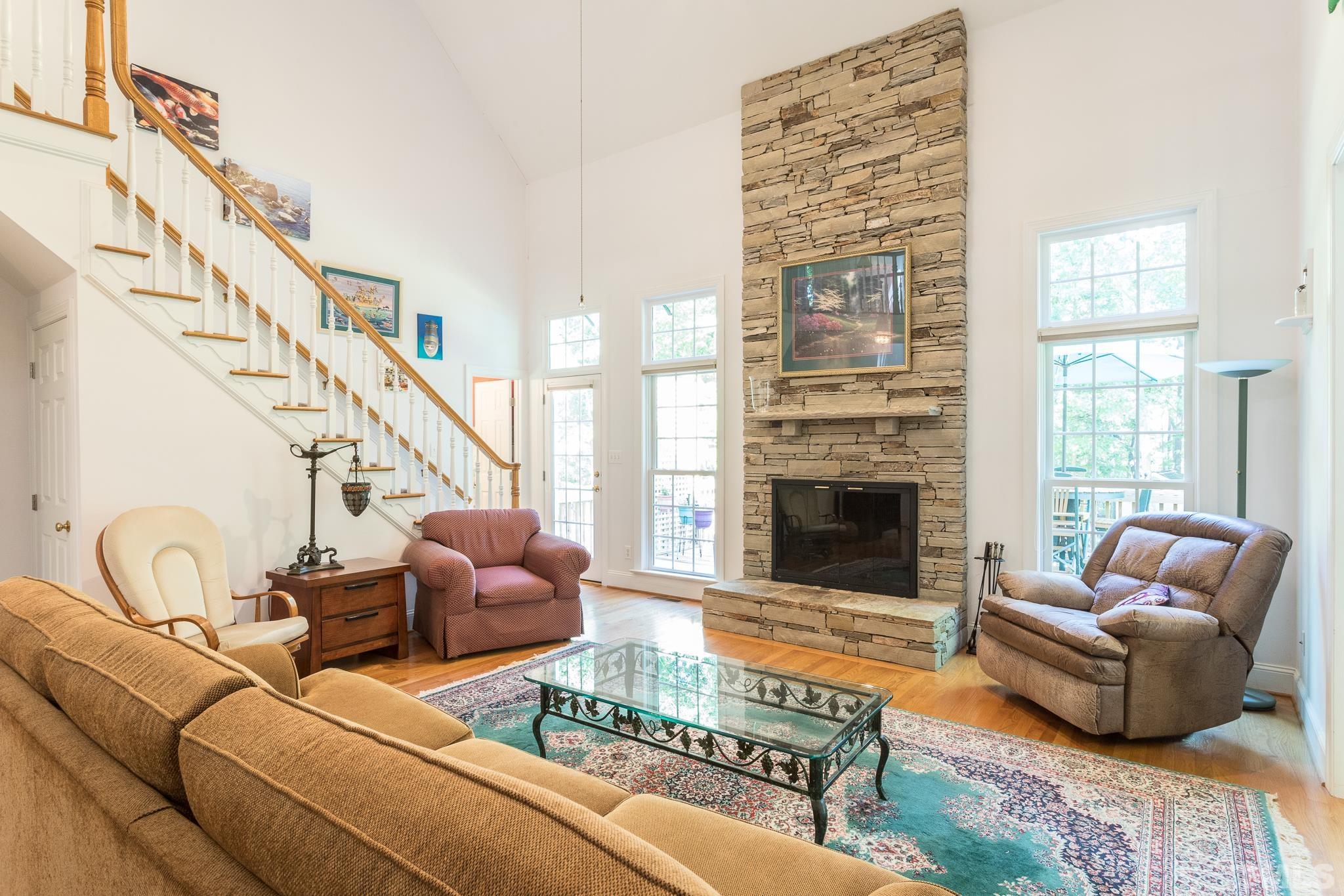 10300 Baileywick Road Raleigh, NC 27613 - Photo 6 of 26 a living room with furniture fireplace and a flat screen tv