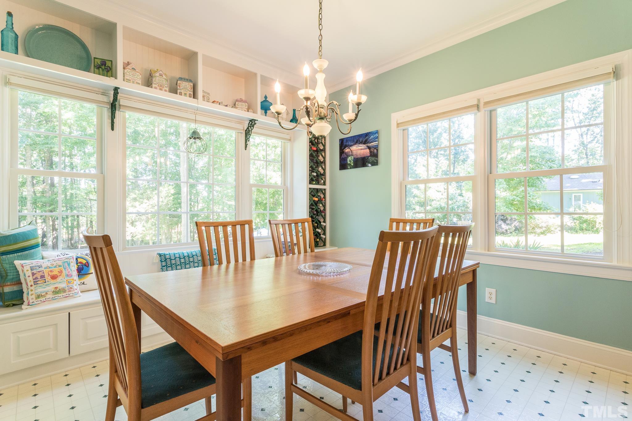 10300 Baileywick Road Raleigh, NC 27613 - Photo 7 of 26 a view of a dining room with furniture window and outside view