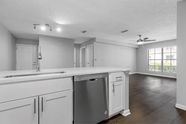 a stove top oven sitting inside of a kitchen