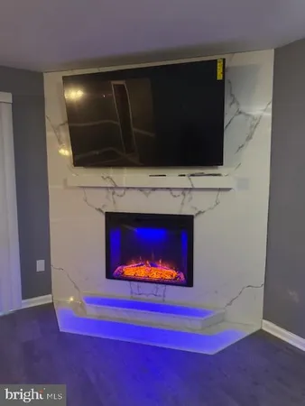 a view of an empty room with a fireplace