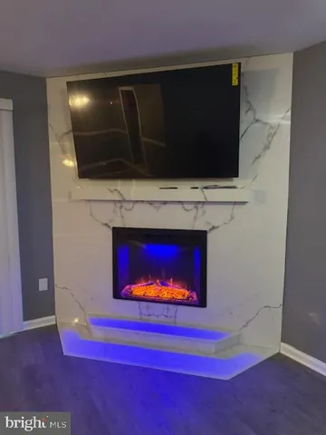 a view of an empty room with a fireplace