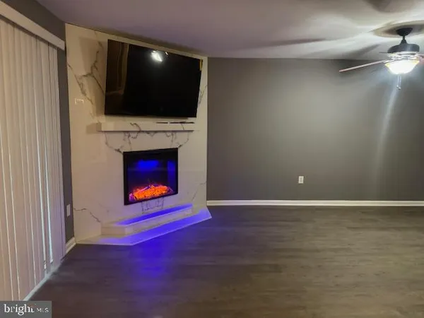 a kitchen with granite countertop a sink stove and microwave