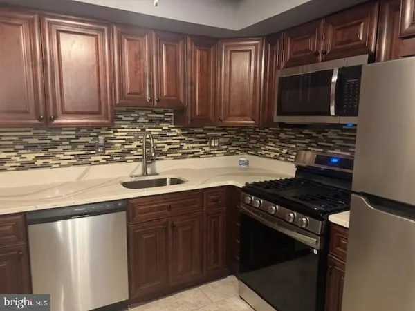 a close view of a utility room with washer and dryer
