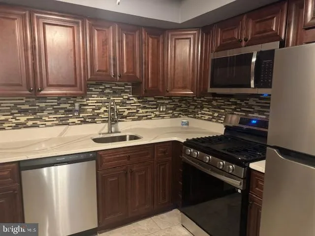 a close view of a utility room with washer and dryer