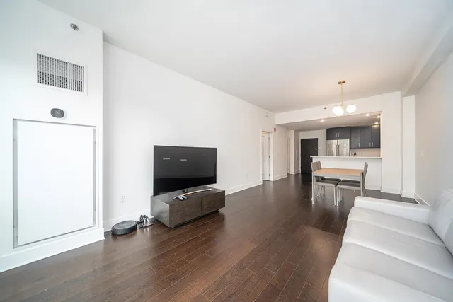 a view of living room with furniture and flat screen tv
