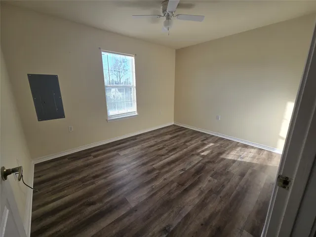 a view of room with window and hardwood floor
