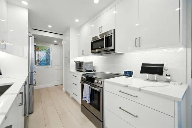 a kitchen with a stove microwave and refrigerator
