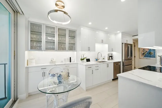 a very nice looking dining room with a table and chairs in it