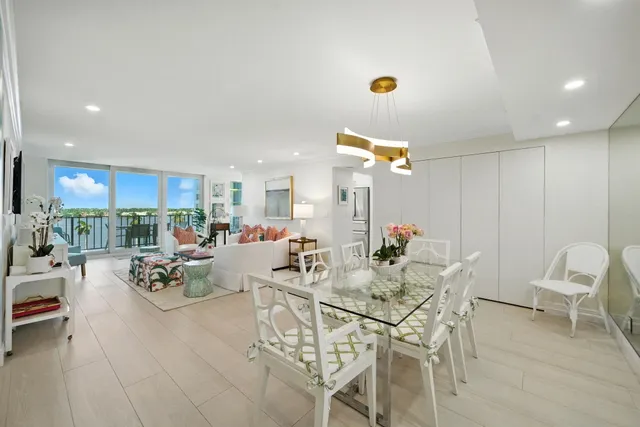 a view of a dining room with furniture and a potted plant