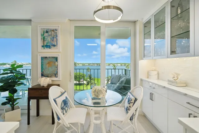 a dining room with furniture a livingroom and chandelier
