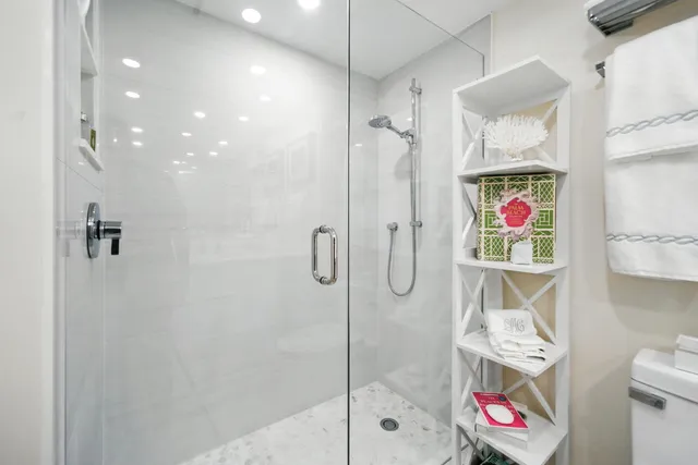 a bathroom with a shower curtain a sink and mirror