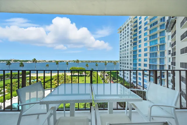 a view of a balcony with lake view and wooden floor
