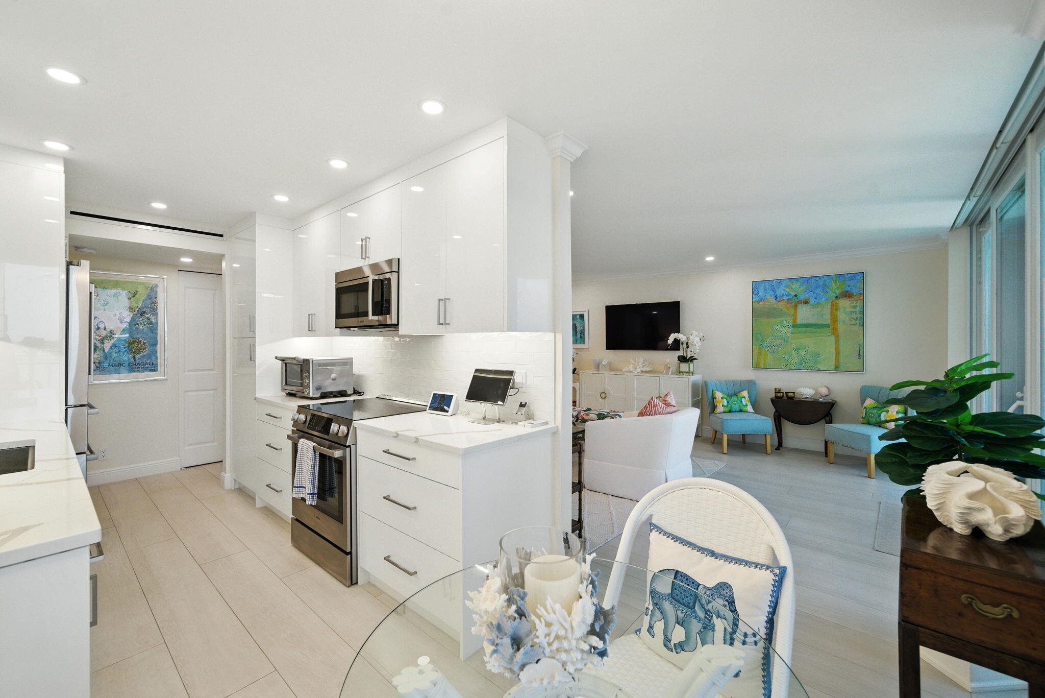 1801 South Flagler Drive, Unit 709 West Palm Beach, FL 33401 - Photo 31 of 39 a living room with furniture a flat screen tv and a fireplace