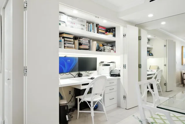 a workspace with furniture and a book shelf