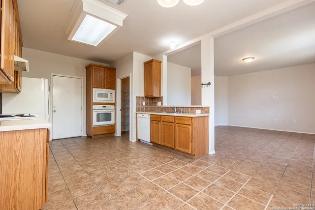 a large kitchen with cabinets