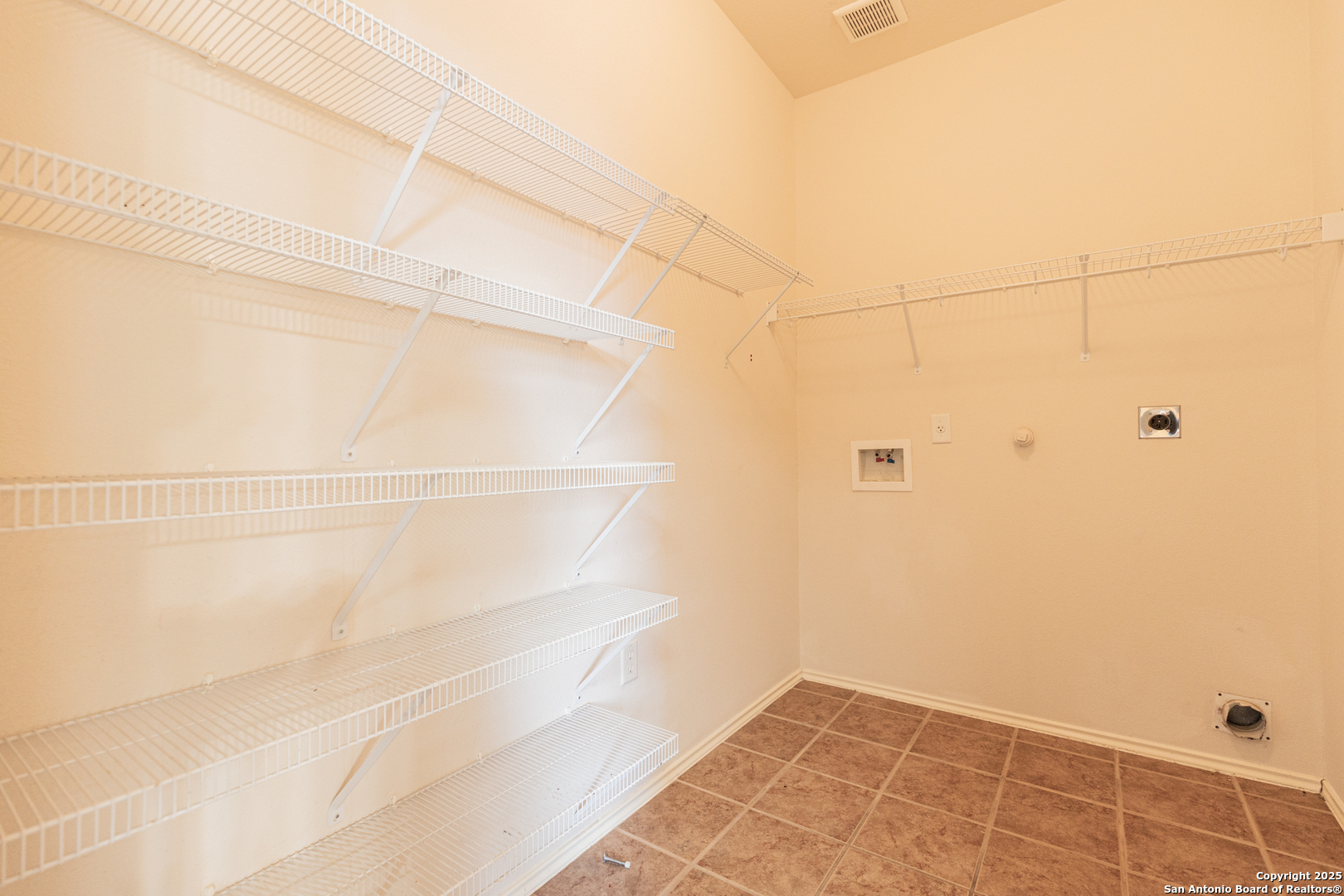 1134 Seven Iron Way San Antonio, TX 78221 - Photo 25 of 33 a view of an empty walk in closet