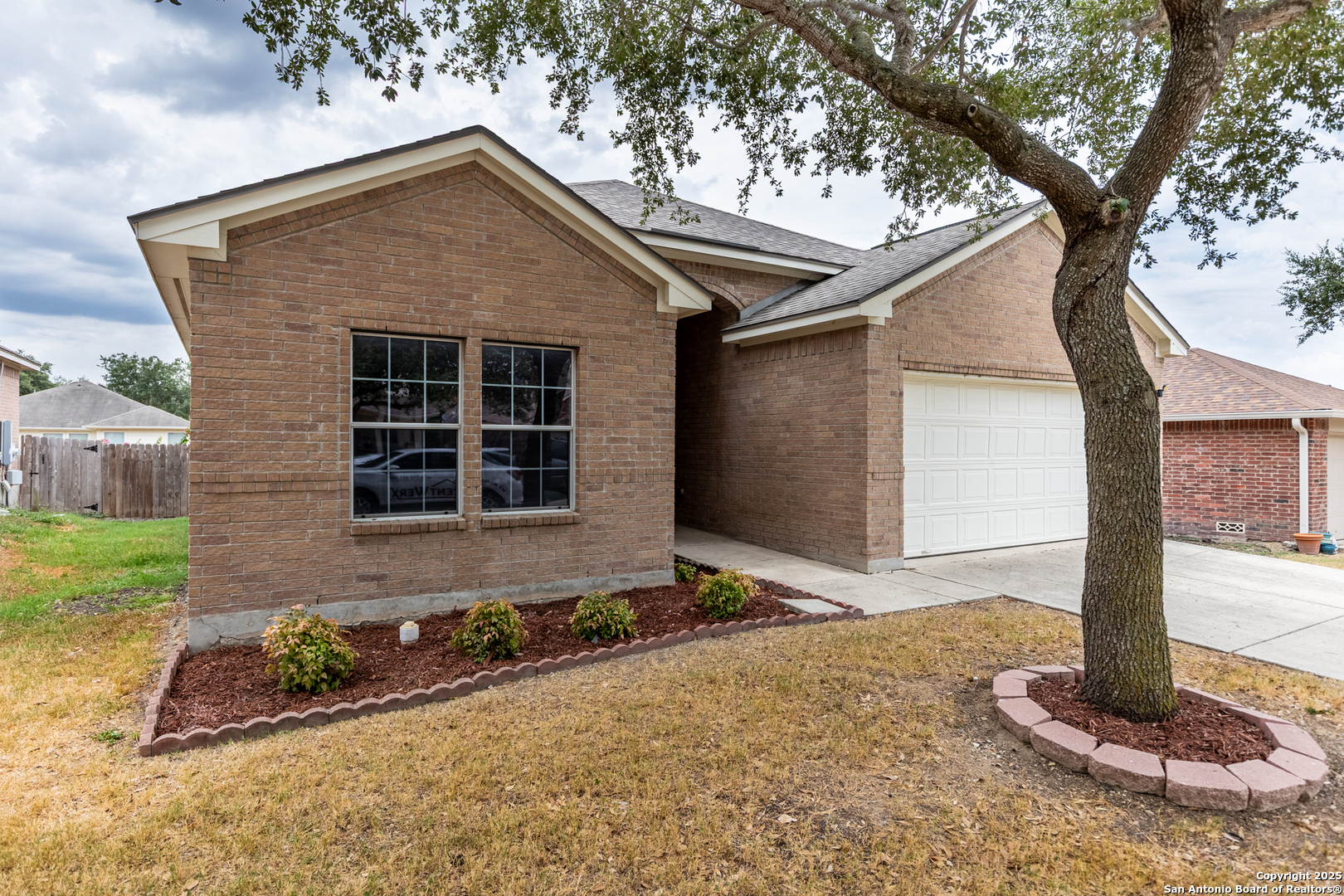 1134 Seven Iron Way San Antonio, TX 78221 - Photo 3 of 33 a front view of a house with garden