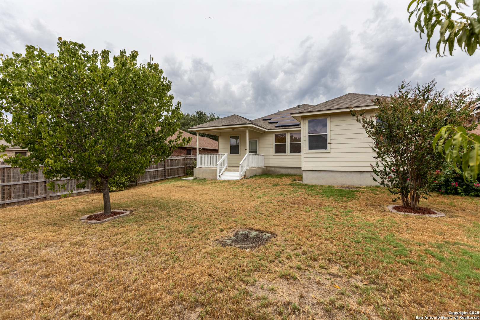 1134 Seven Iron Way San Antonio, TX 78221 - Photo 31 of 33 a house view with a garden space