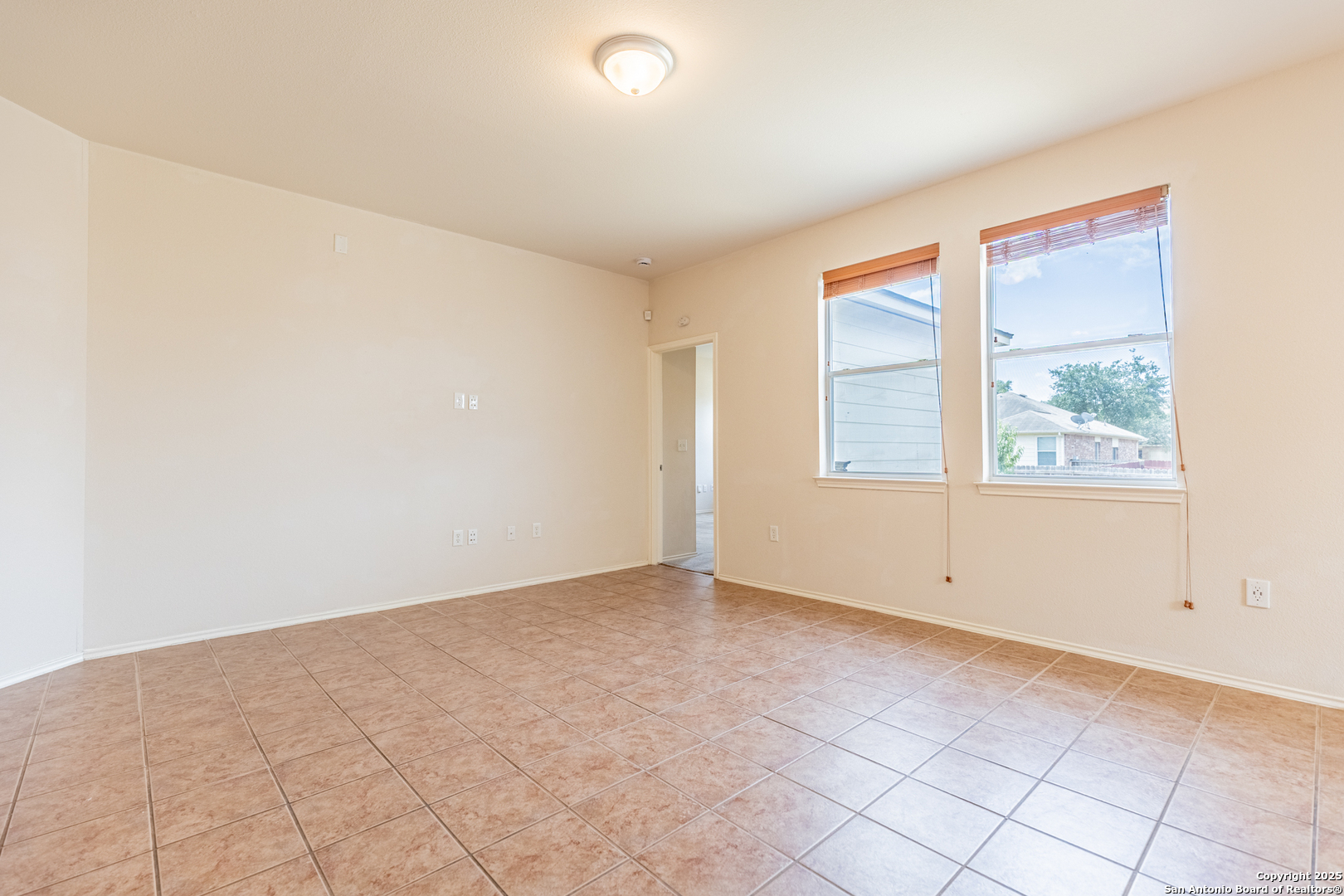 1134 Seven Iron Way San Antonio, TX 78221 - Photo 7 of 33 an empty room with windows