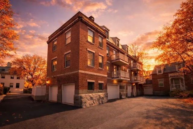 a view of a building with a yard