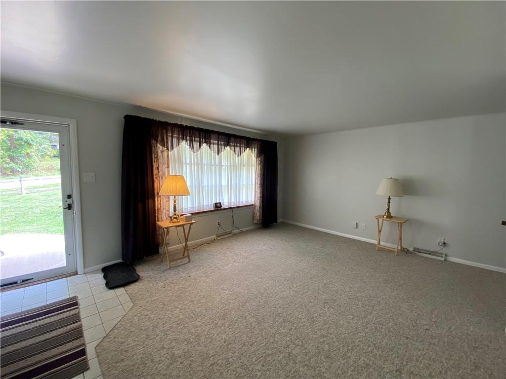 262 Thorne Run Road Export, PA 15632 - Photo 2 of 19 an empty room with windows