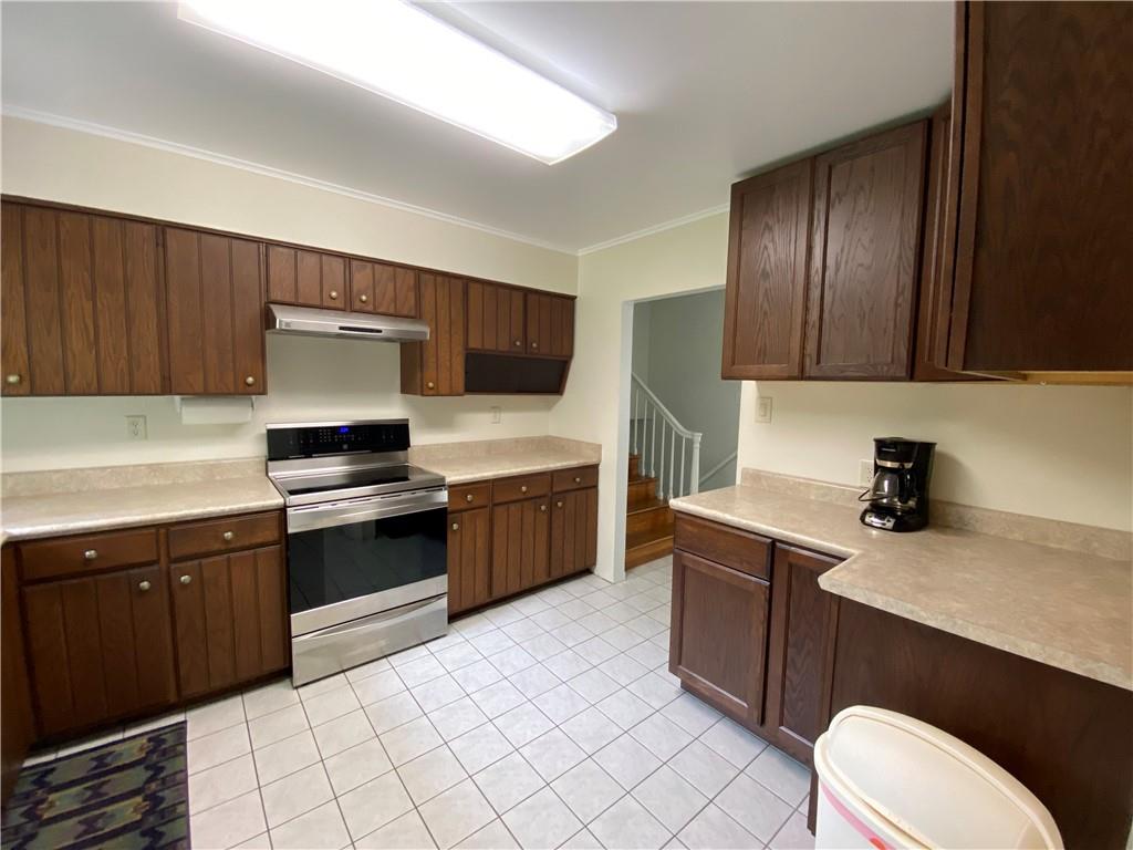 262 Thorne Run Road Export, PA 15632 - Photo 3 of 19 a kitchen with stainless steel appliances a sink dishwasher stove refrigerator and cabinets