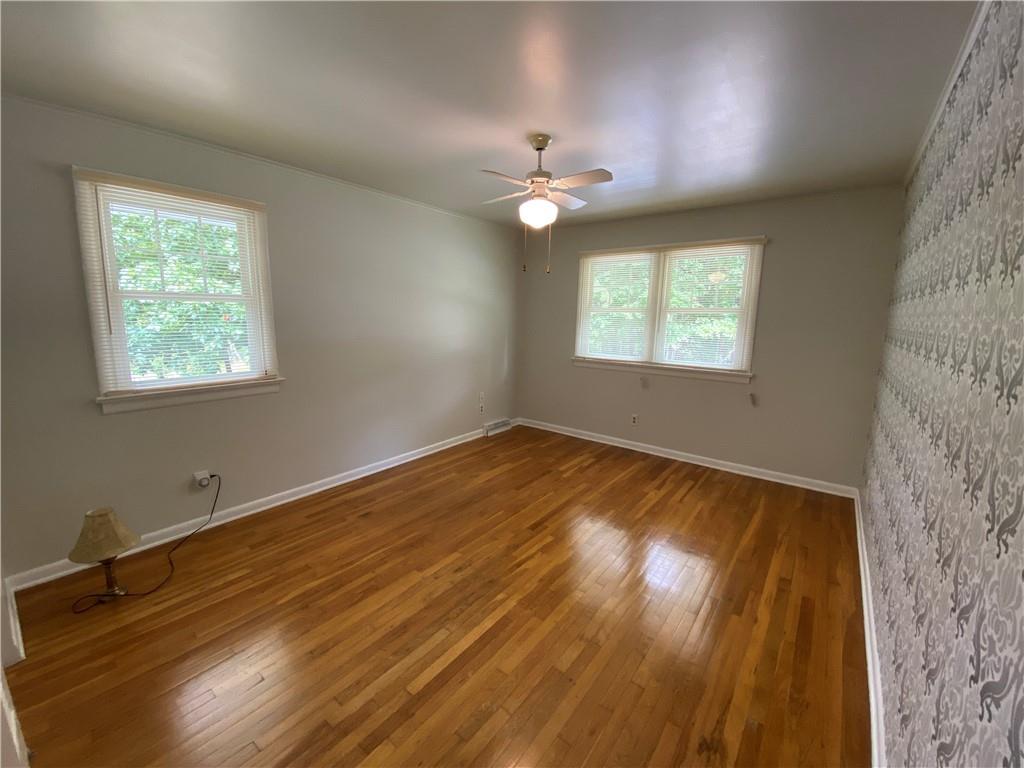 262 Thorne Run Road Export, PA 15632 - Photo 5 of 19 a view of an empty room with wooden floor and a window