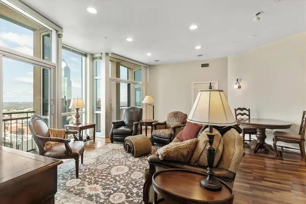 a living room with furniture and a lamp