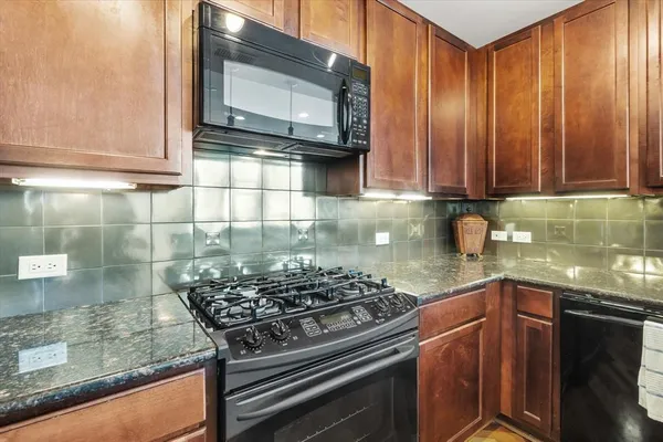 a kitchen with a stove and a microwave