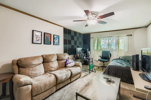 a living room with furniture and a large window