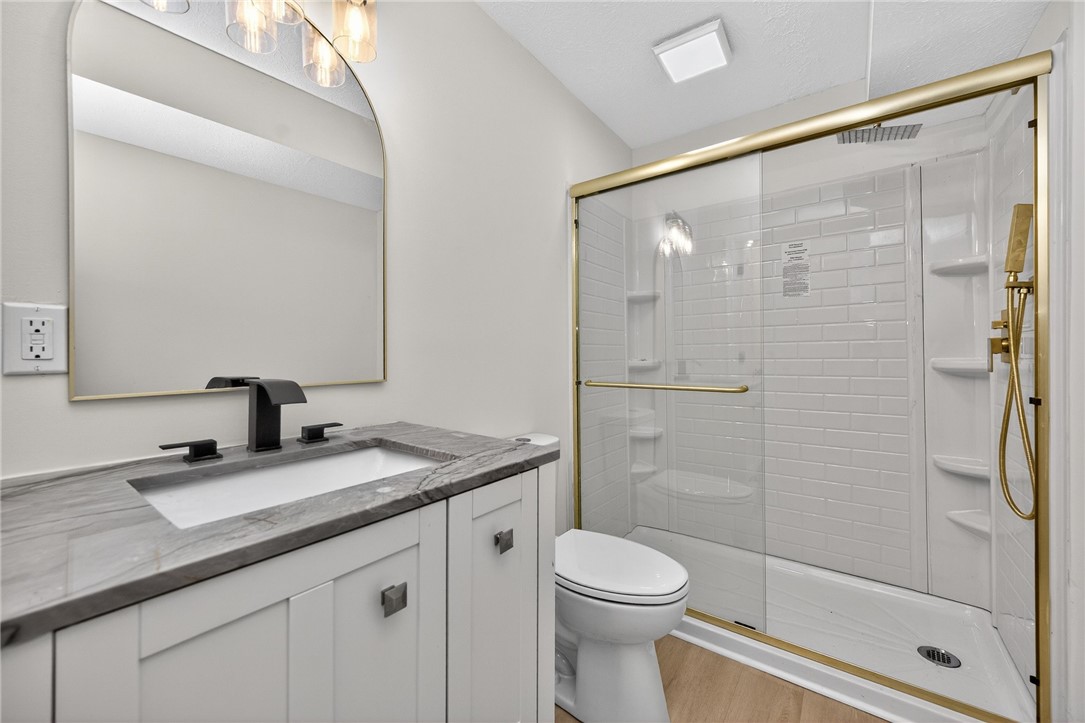811 Wind Bluff Point Springboro, OH 45066 - Photo 42 of 51 This sleek bathroom features a modern vanity with elegant countertops and a spacious shower.