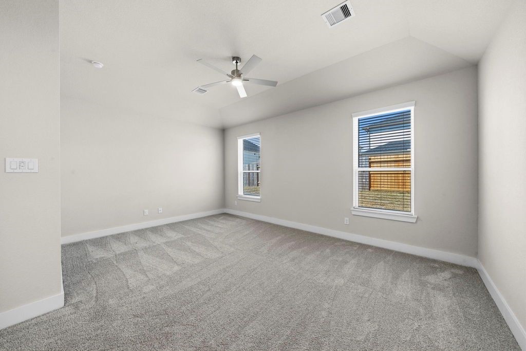 1972 Golden Spruce Lane Conroe, TX 77301 - Photo 12 of 19 an empty room with a window and ceiling fan