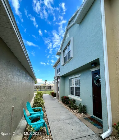 a front view of a house with outdoor space and seating space