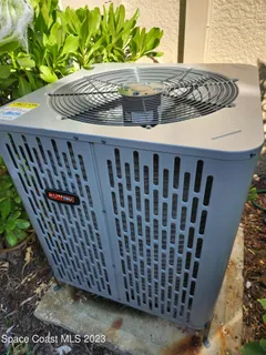 a view of a swimming pool with outdoor seating