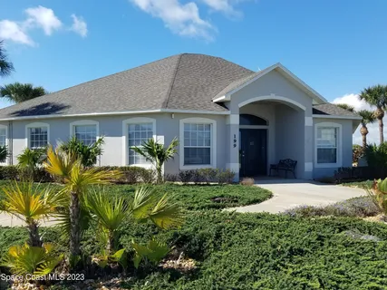 a room with pool table and windows