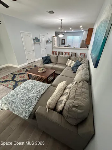 a living room with furniture and a rug