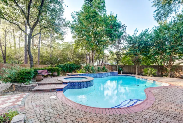 a view of a swimming pool with a patio