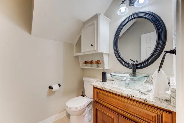 a living room with granite countertop furniture and a mirror
