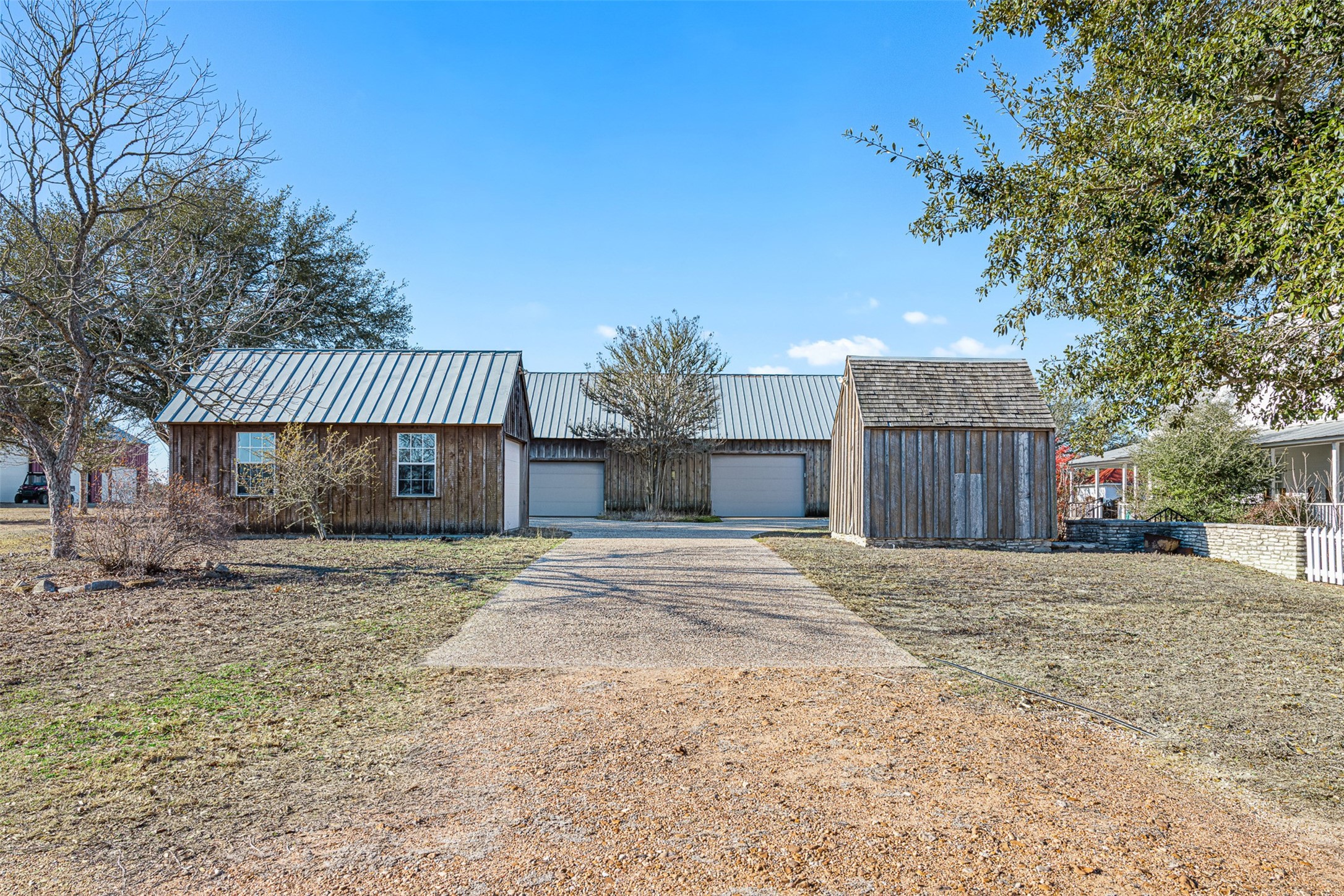 2998 Highway 237 Round Top, TX 78954 - Photo 12 of 43 a front view of a house with a yard and garage