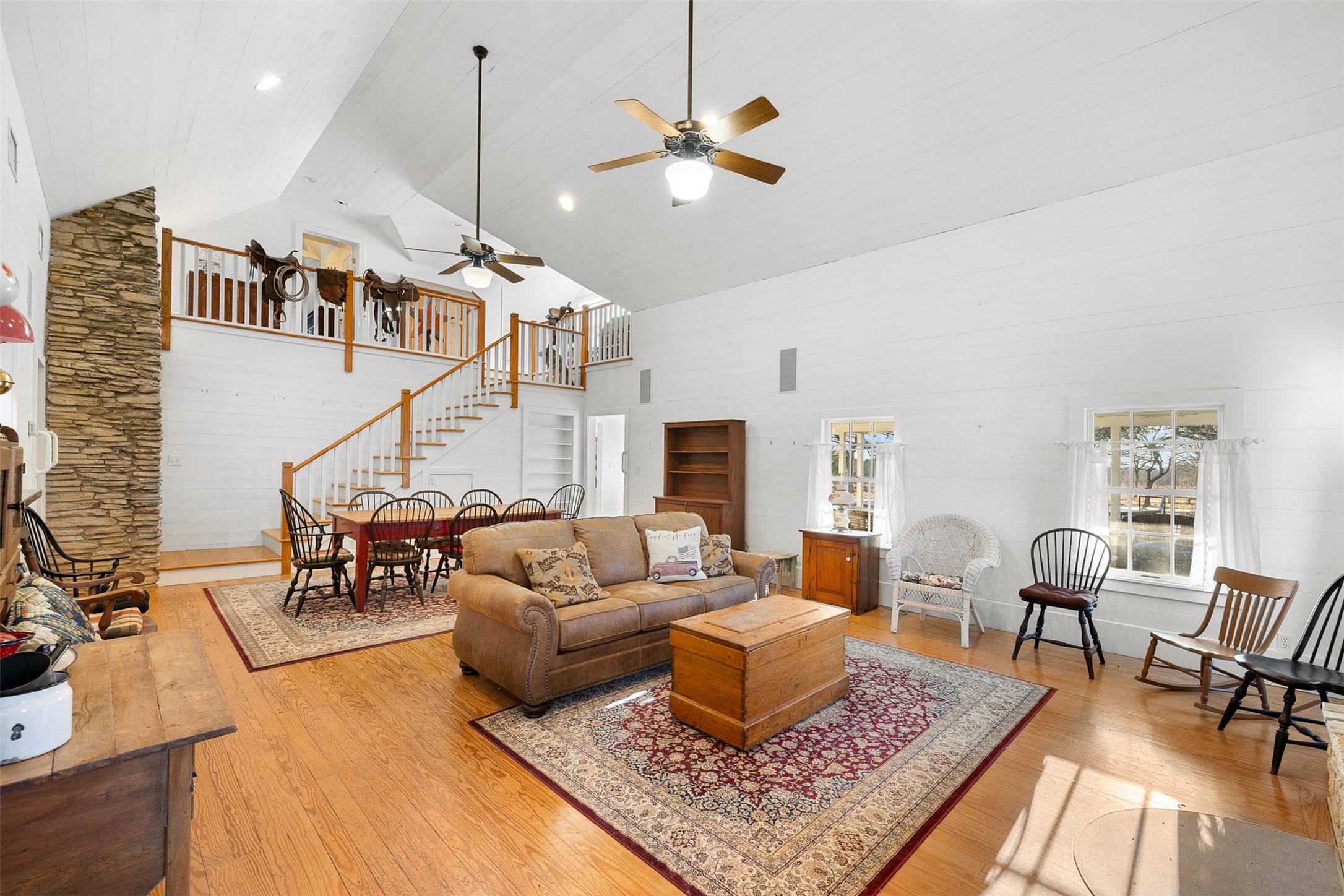 2998 Highway 237 Round Top, TX 78954 - Photo 16 of 43 a living room with furniture a rug and a chandelier