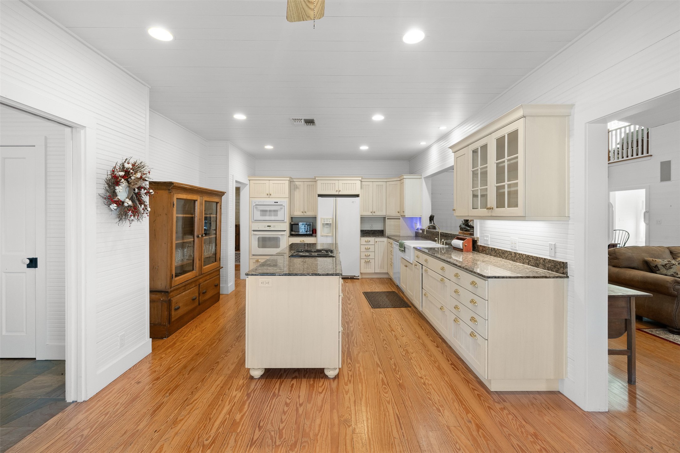 2998 Highway 237 Round Top, TX 78954 - Photo 20 of 43 a large space with kitchen island wooden floor and stainless steel appliances