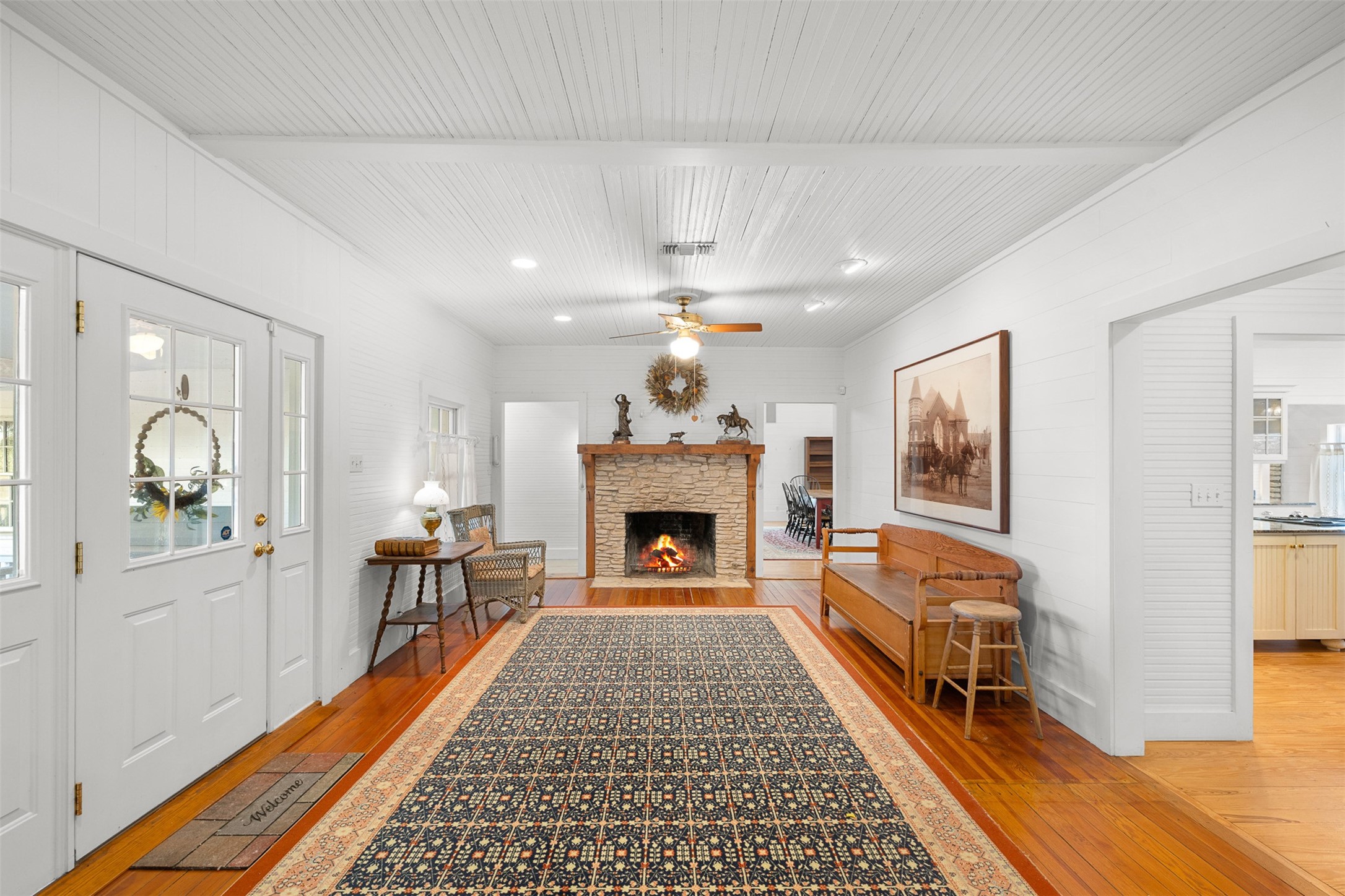 2998 Highway 237 Round Top, TX 78954 - Photo 22 of 43 a living room with furniture a fireplace and a table