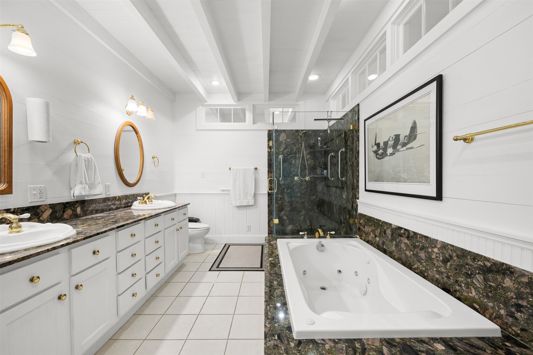 2998 Highway 237 Round Top, TX 78954 - Photo 27 of 43 a bathroom with a granite countertop double vanity sink mirror and bathtub